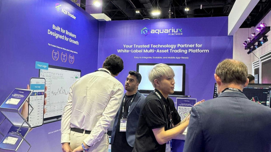 Aquariux_ifx Dubai 2026 booth interaction_image 2.jpg